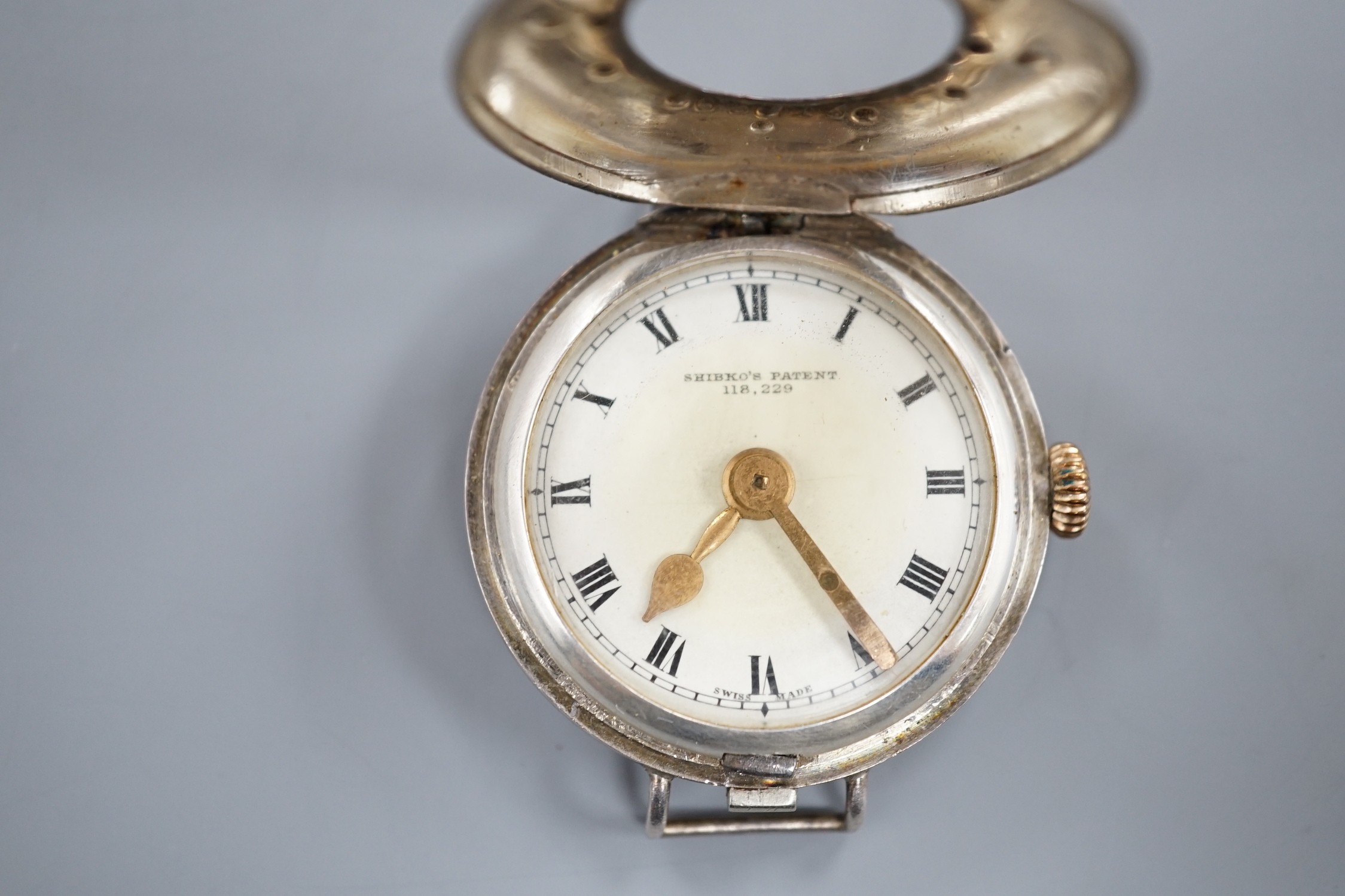 A gentleman's silver Shibko's patent Braille dial manual wind wrist watch, no strap.